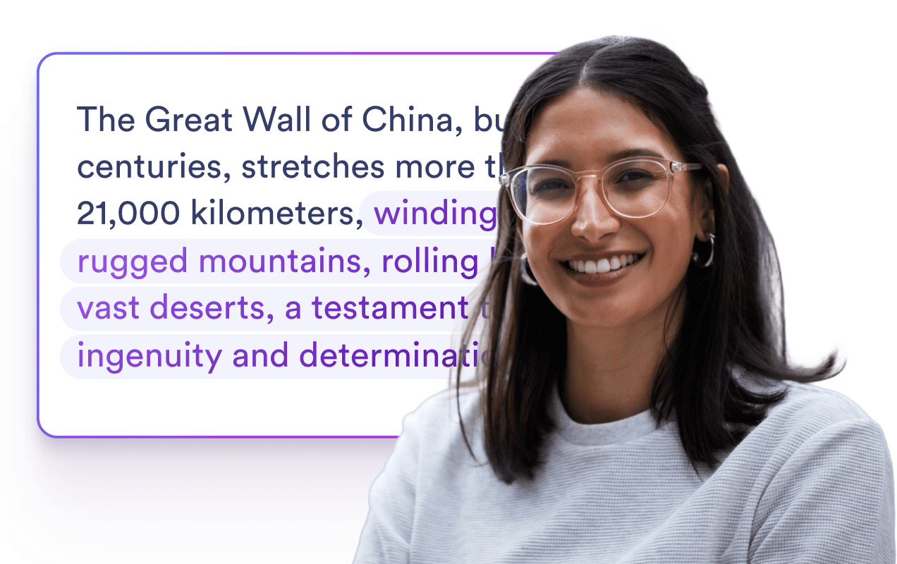 Woman smiling in front of a card about an expanded sentence.