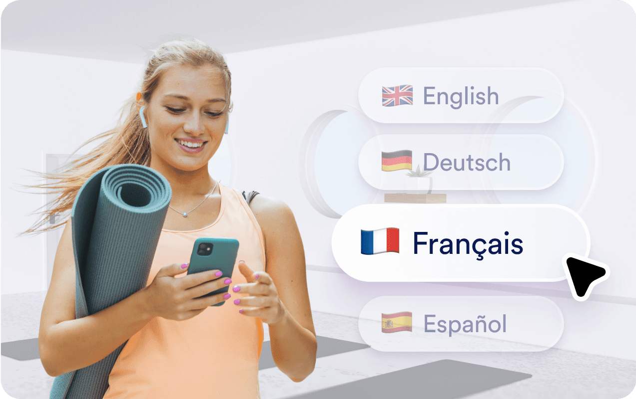 Woman smiling while choosing language on her phone.